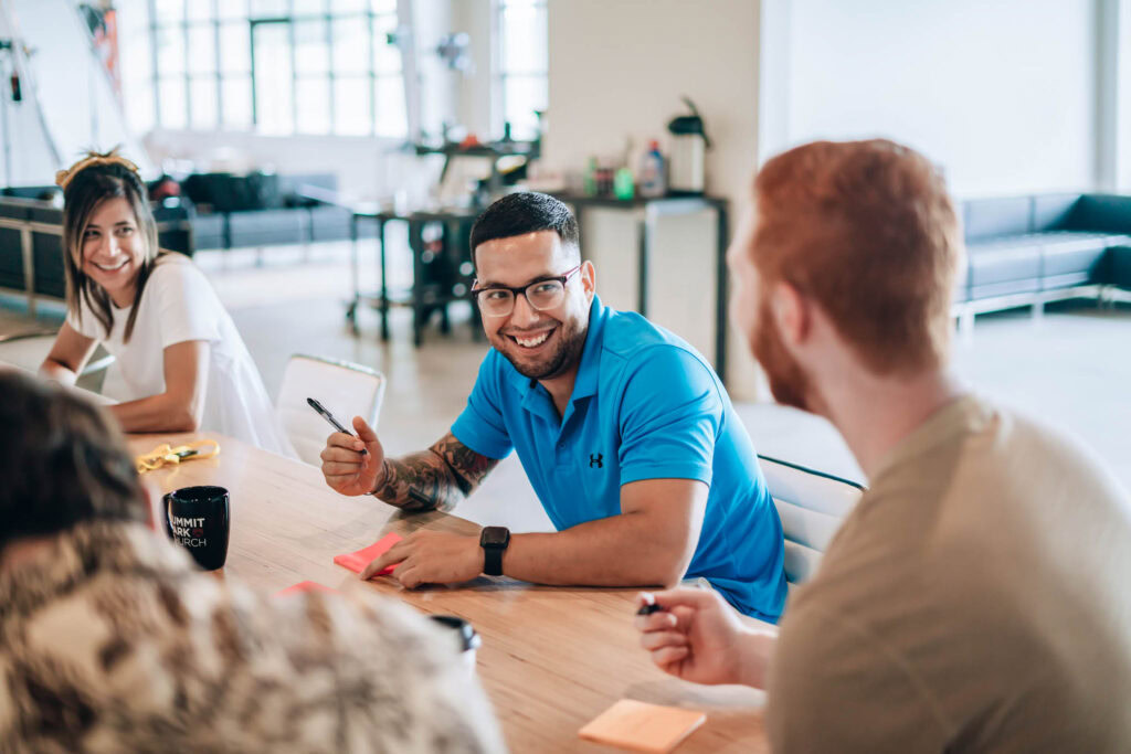 Engaged church leaders collaborating during a church meeting or planning session.