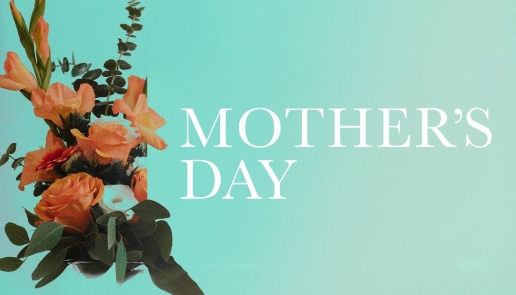 Teal floral arrangement for Mother's Day celebration, featuring peach and pink flowers with green fo.